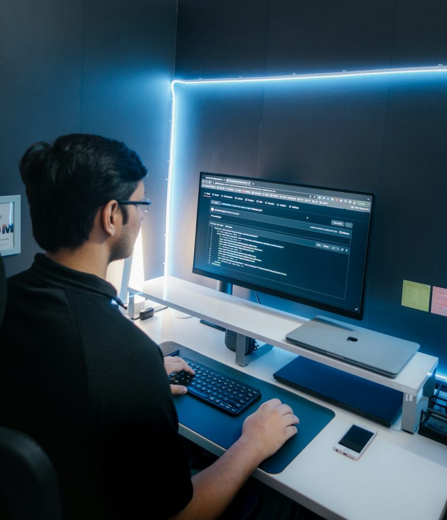 a-person-sitting-at-a-desk-looking-at-a-computer-screen-gmlhhgjcloq