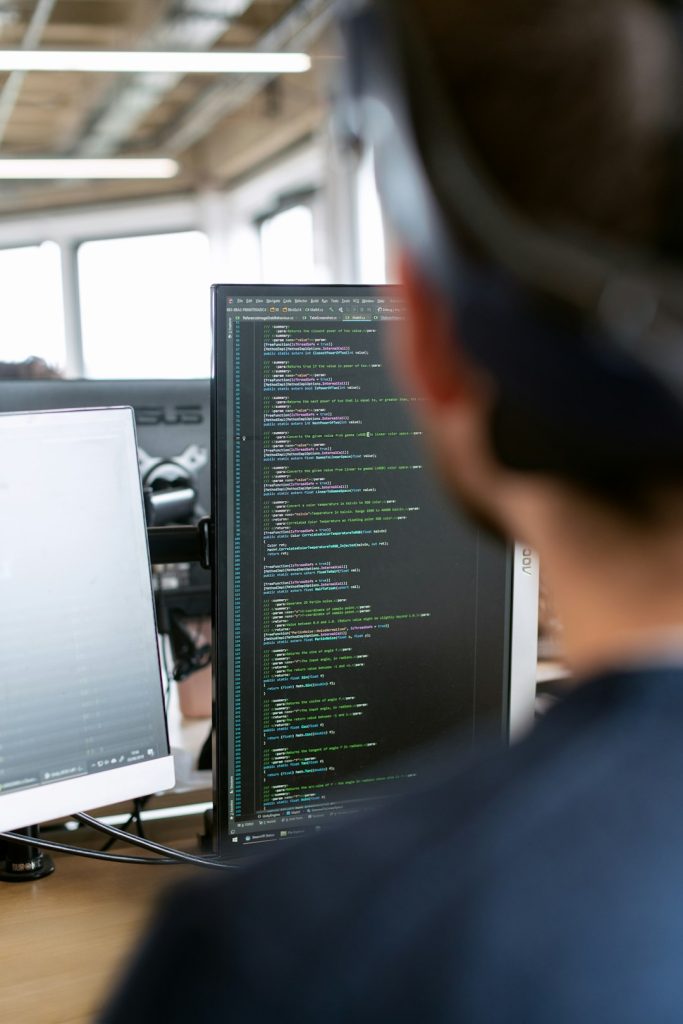 Male engineer coding for virtual reality headsets